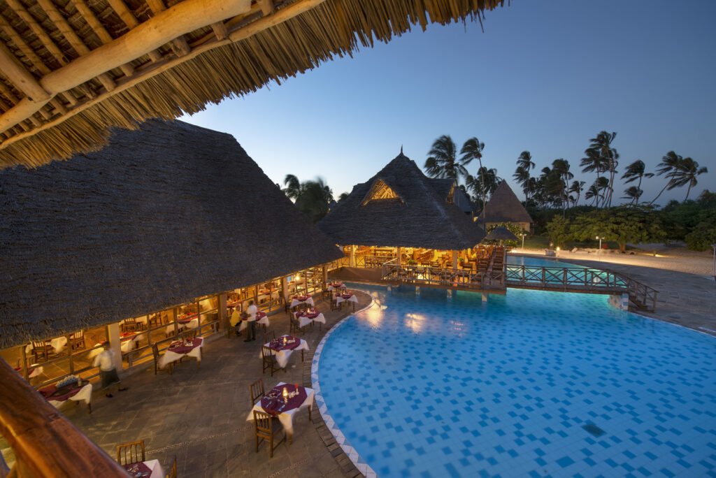 Neptune Pwani Main Restaurant Evening Pool View