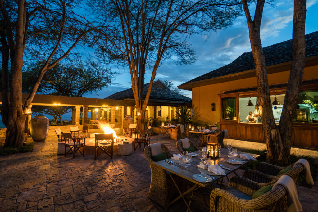 Singita Sasakwa Lodge_Outdoor Evening Dining with Fire