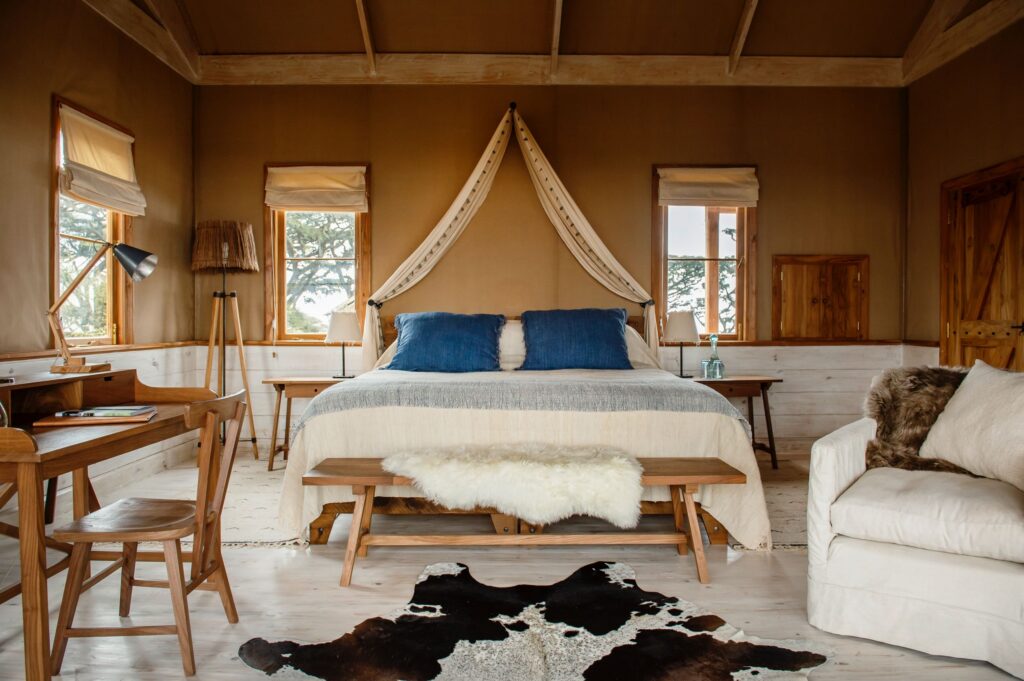 Stretch canvas cottage room with a double bed