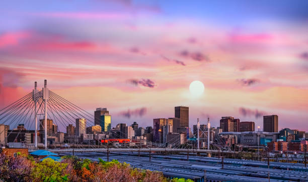 Long exposure shot of Johannesburg city skyline and Nelson Mandela bridge at sunset